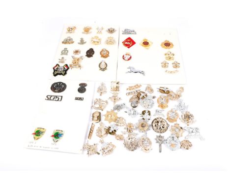 21 modern British cap badges, some silvered, gilt or enamelled, including The Scottish Yeomanry, The Heavy Cavalry, Light Cav