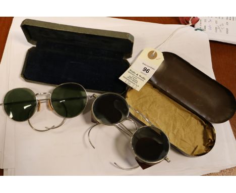 A pair of Air Ministry wire framed tinted glasses, in their original khaki painted tin box, the lid marked "A crown M, 204/11