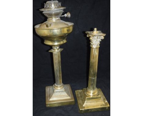 A brass table lamp base in the form of a Corinthium column on a stepped base, together with a Victorian oil lamp base the wel