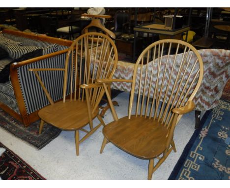 A pair of modern Ercol light elm and beech elbow chairs   CONDITION REPORTS  No cushions.  Both chairs show various scratches