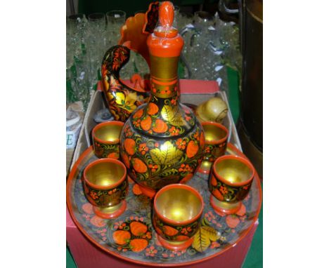 A box of lacquered and painted wares including Indian candlesticks, Russian lacquered koysh set with bird bowl, three Russian