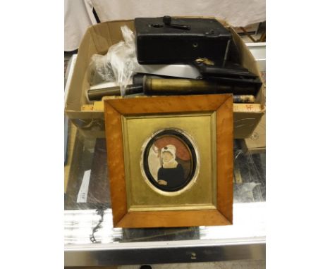 A box containing a Cine Kodak Model B camera No'd. 57982, a W Ottway & Co. Ealing army telescope, an E. O Co. telescopic sigh