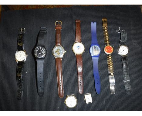A collection of nine various watches bearing various names to include Swatch, Gucci, Rolex, etc   CONDITION REPORTS  Unknown 