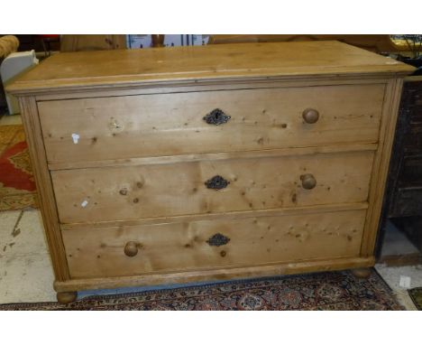 A Continental pine commode of three drawers, together with a pine double bedstead