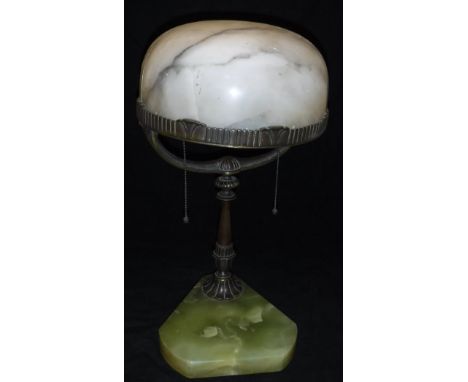 An early 20th Century table lamp with domed white alabaster shade raised on a bronzed Y shaped column to a triangular onyx ba