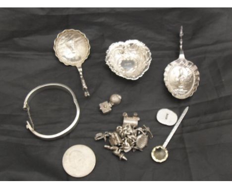 A silver embossed dish in the form a stylised love heart (W I Broadway, Birmingham), together with two silver import Dutch te