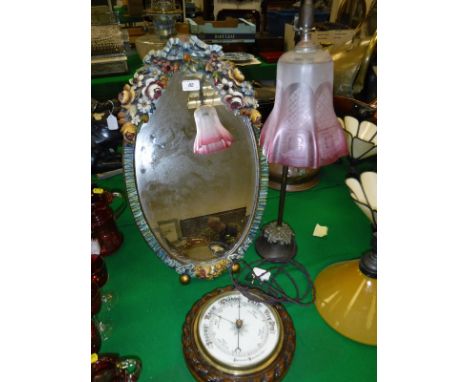 An oak cased aneroid barometer, desk lamp with acid etched cranberry shade and a painted framed easel mirror with oval bevel 