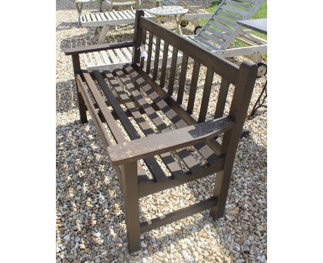 A modern garden bench of slatted form