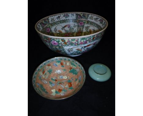 A modern Cantonese famille rose punch bowl, similar vase and a smaller bowl decorated with flowers and butterflies and a cela