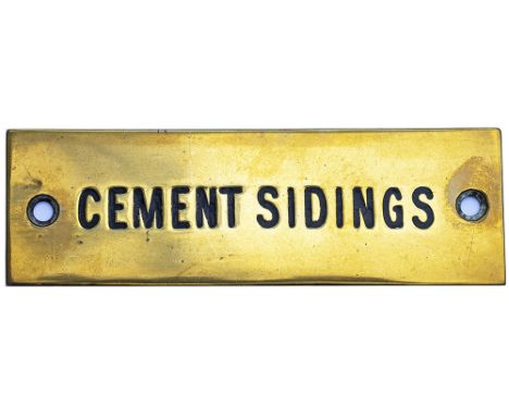 GWR machine engraved brass shelf plate CEMENT SIDINGS. In very good condition with original black wax infill. Measures 4.75in