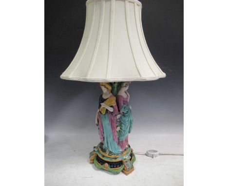 A majolica figural centrepiece, modelled as three maidens, converted to a lamp, 42cm high