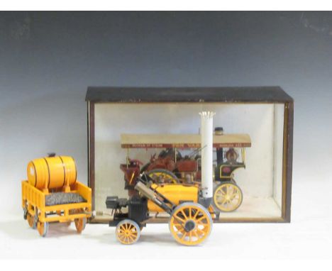 A miniature steam engine in a glazed wooden case and a Hornby model of The Rocket (2)
