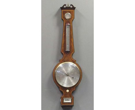 A Regency mahogany wheel barometer, maker Blandford, with silvered dial, the case with boxwood and ebony stringing with swan 