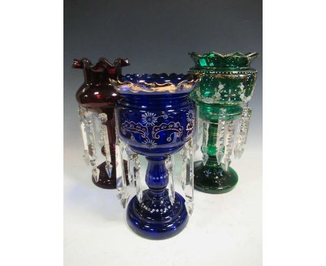 Three glass lustres, in green, blue and ruby, the tallest - 37cm high
