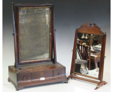 A George II style mahogany dressing table mirror, the rectangular mirror with gilt slip above a three drawer base on ogee bra