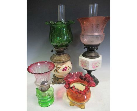 Two Victorian oil lamps, with pottery resevoirs; small glass oil lamp and a vase. Together with blue ribbed pottery lamp base
