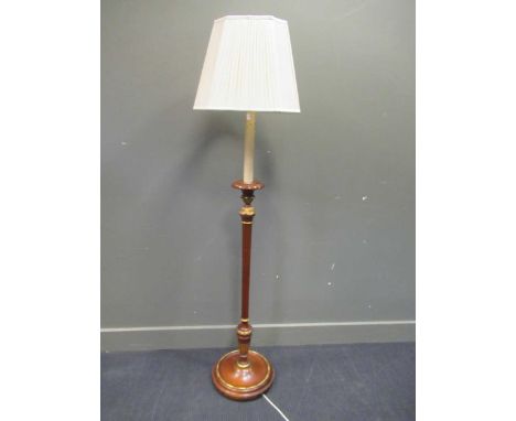 A 20th century mahogany and gilt standard lamp in the Neo classical style, 168cm high including shade