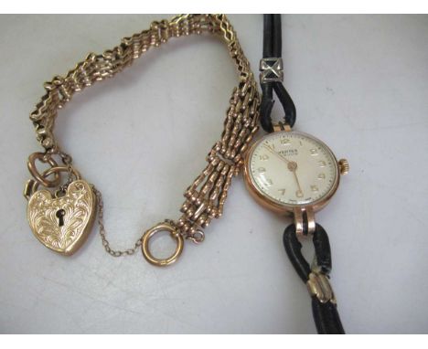 A 9ct gold gate bracelet,16.6 grams together with a 9ct gold lady's 'Vertex' wristwatch (2) 