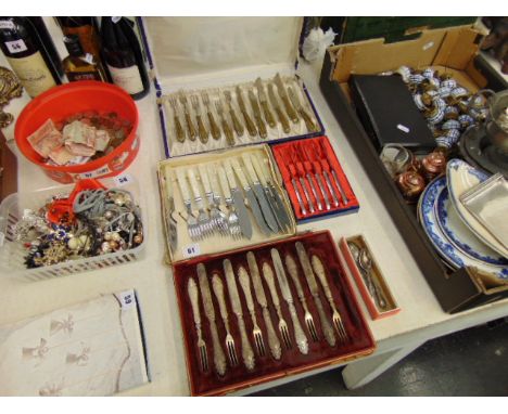 A qty of boxed flatware, some with silver handles