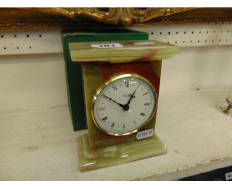 An Onyx mantle clock, batter, working order, by Azizoff of London, 15cm x 12cm