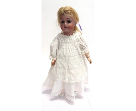 A SIMON & HALBIG FOR KAMMER & REINHARDT BISQUE SOCKET HEAD DOLL  with a long blonde wig, sleeping brown glass eyes, pierced e