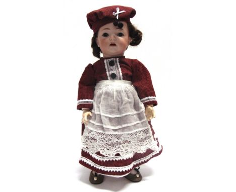 A SIMON & HALBIG FOR KAMMER & REINHARDT BISQUE SOCKET HEAD CHARACTER DOLL  with a replacement brown wig, sleeping brown glass