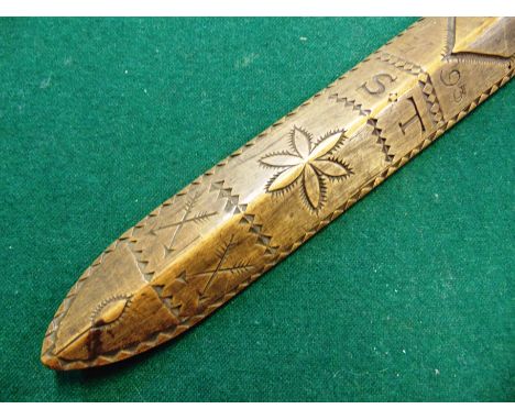 AN 18TH CENTURY CARVED TREEN STAY BUSK LOVE TOKEN dated '1793' and incorporating the initials 'S T', with heart, flower head 