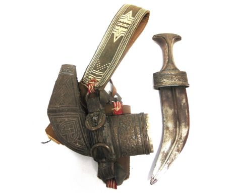 A JIMBAYA  of typical curved form, the scabbard with foliate metal mounts and geometric decoration, overall, 30cm long.  Prov