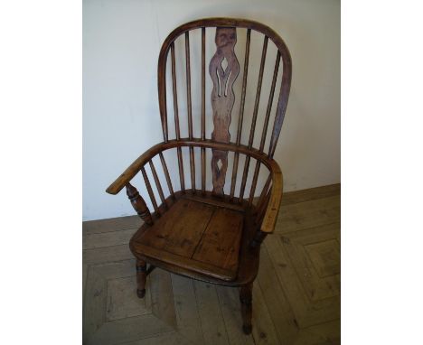 Late 19th C elm Windsor stick back armchair with pierced central splat with H shaped under stretcher and turned supports, wit