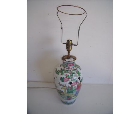 Chinese ceramic vase converted to a table lamp depicting various female figures within floral background encompassing a stag 