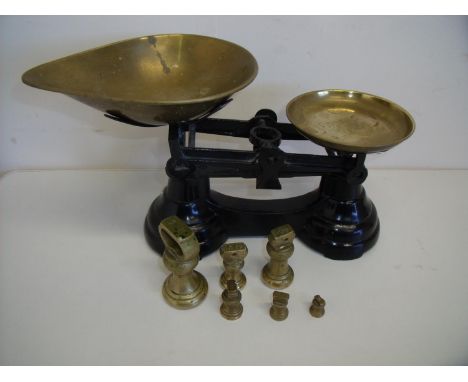 Set of brass and painted kitchen scales with a set of graduating dumbbell weights 
