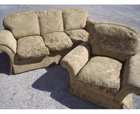 Two piece suite comprising of large three seat sofa and matching armchair 