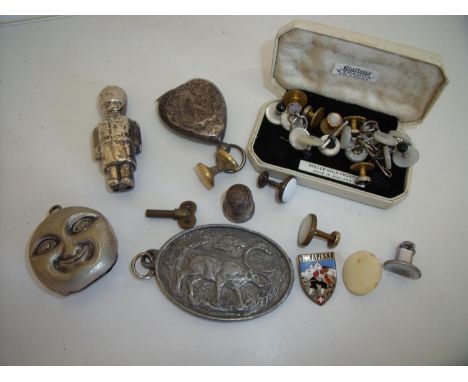 Selection of Mother of Pearl and various other dress studs, an enamel hiking badge, thimble, part of a baby's moon faced ratt