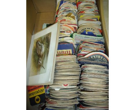 A large collection of various assorted vintage beer mats and various wildlife books, plates and prints 