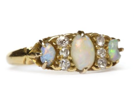 VICTORIAN OPAL AND DIAMOND RING
the boat shaped bezel set with three graduated oval opals interspaced by two pairs of diamond