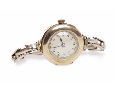 LADY'S EARLY TWENTIETH CENTURY ROLEX NINE CARAT GOLD MANUAL WIND WRIST WATCH
signed Rolex 15 jewel movement, the round white 