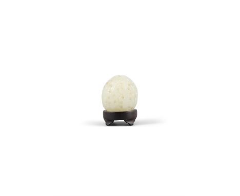 A WHITE JADE CARVED WALNUT WITH WOODEN STAND清代 白玉核桃China, 19th centuryH: 3.5cm