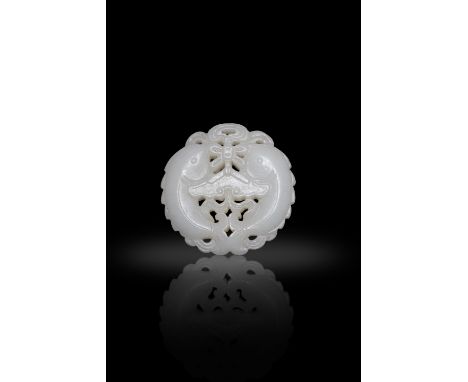 A WHITE JADE RETICULATED CIRCULAR PENDANT WITH DOUBLE-FISH清代 白玉吉慶有餘雙魚珮China, Qing dynastyD.5.3cm