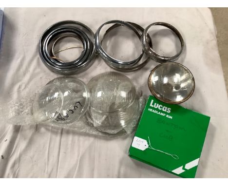 Various sizes of headlamp rims and glass.