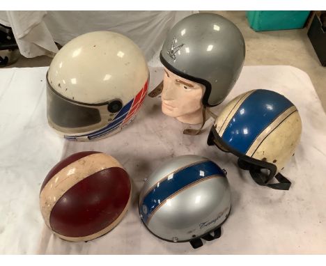 Five helmets including AGV pudding basin, for display purposes only.