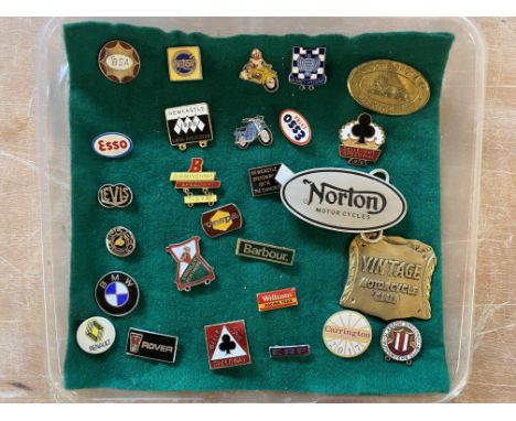 A selection of lapel badges including BSA, Esso, Levis, Triton etc.