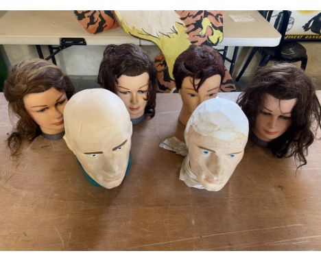Four mannequin heads and two others, ideal for displaying hats and helmets.