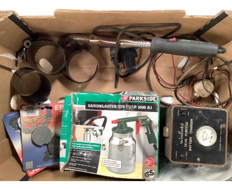Various tools including a vacuum carburettor synchroniser.