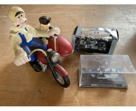 A contemporary and decorative model of Wallace and Grommit on a motorcycle plus two small scale models of a Ducati Scooter Cr