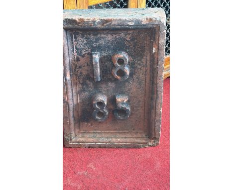 Heavy rectangular brick building date plaque with raised Gothic numerals “1885”, moulded border, and weathered patination, li
