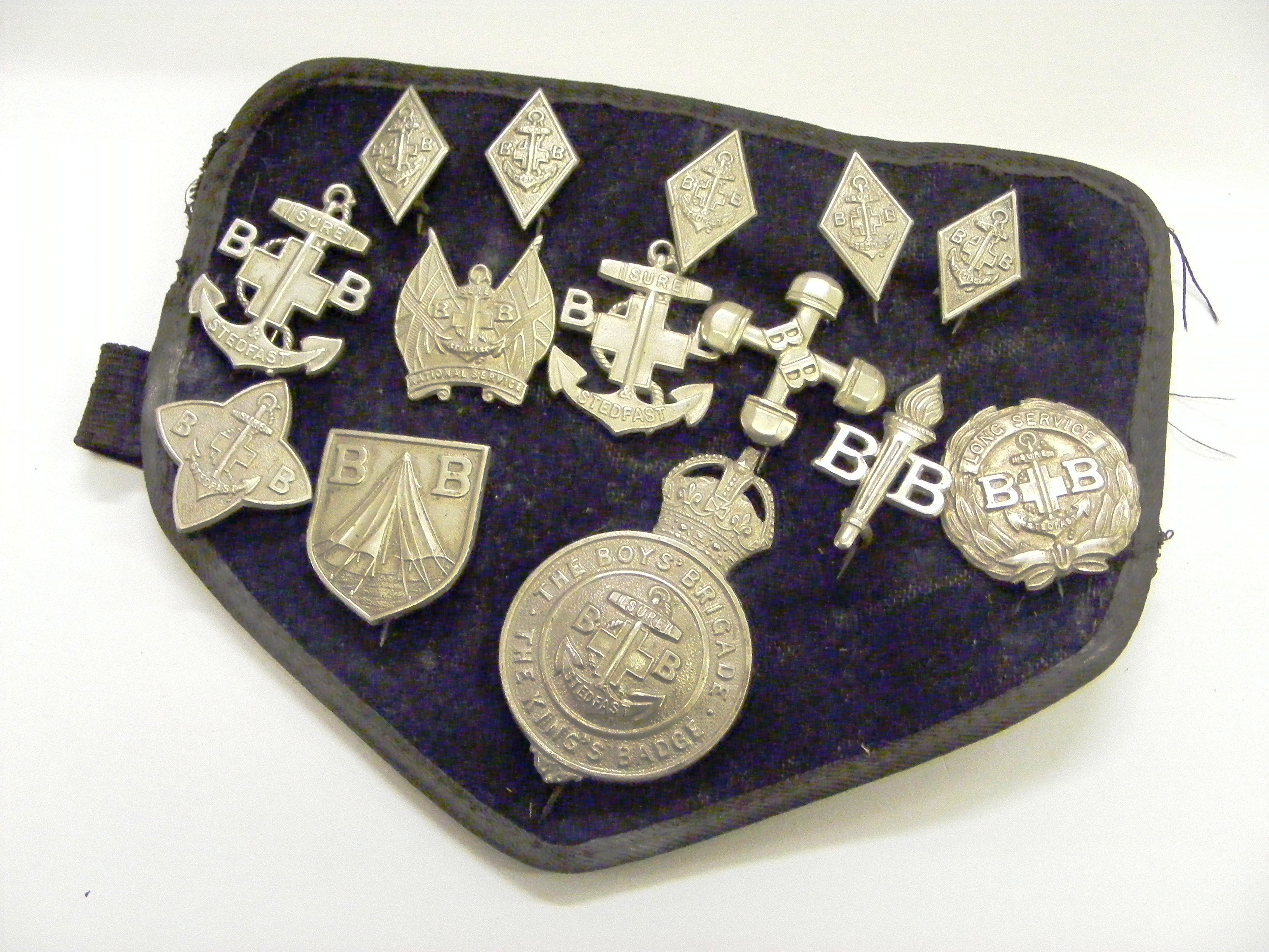 An arm band of boys brigade badges.