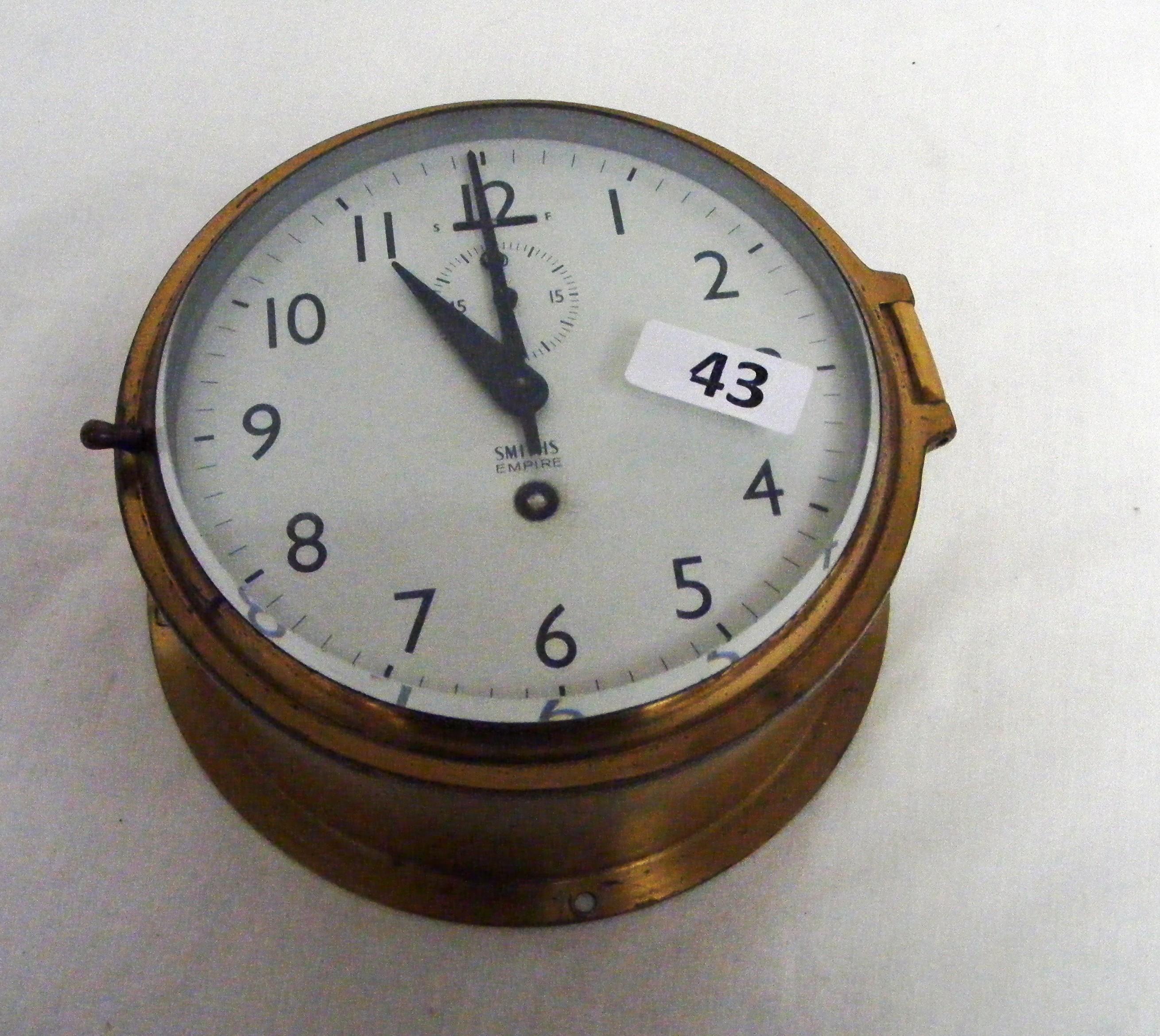 A Smiths Empire 8 day bulkhead brass ships clock with subsidiary