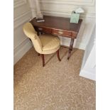 A Regency style Rosewood writing desk The moulded top inlaid with boxwood is supported by a simple