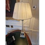 A French Empire style Corinthian Column lamp nickel and glass raised on a stepped base with