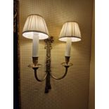 A pair of antiqued brass French style wall appliques twin arm bow and ribbon design backplate 40cm (
